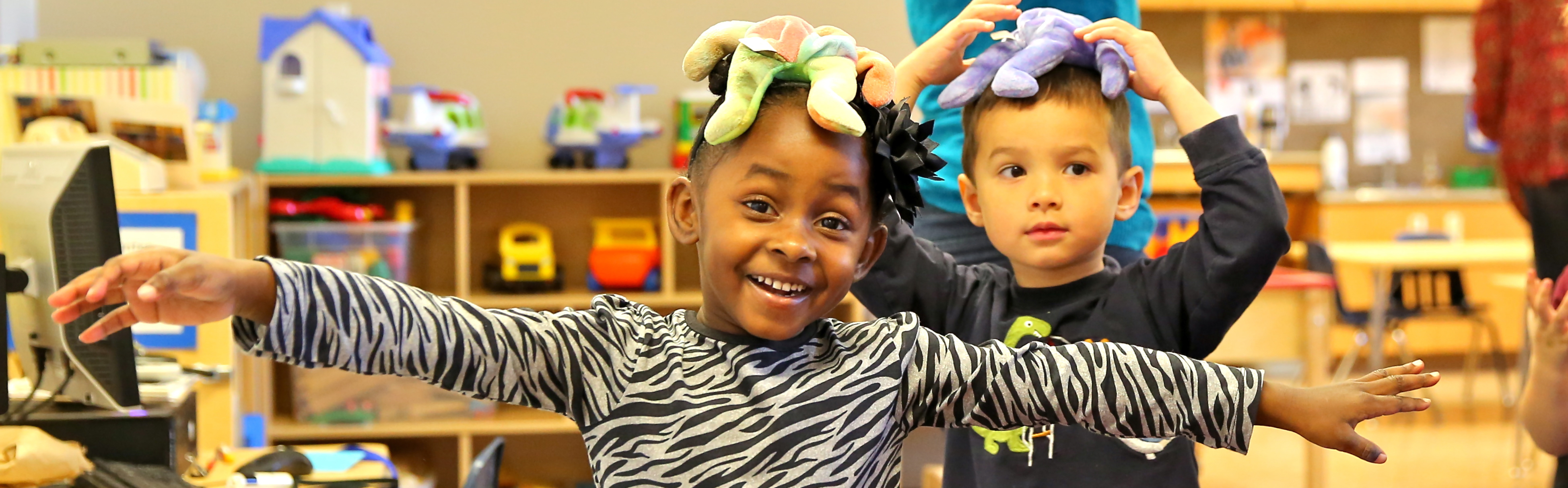 two preschool children playing in the classroom